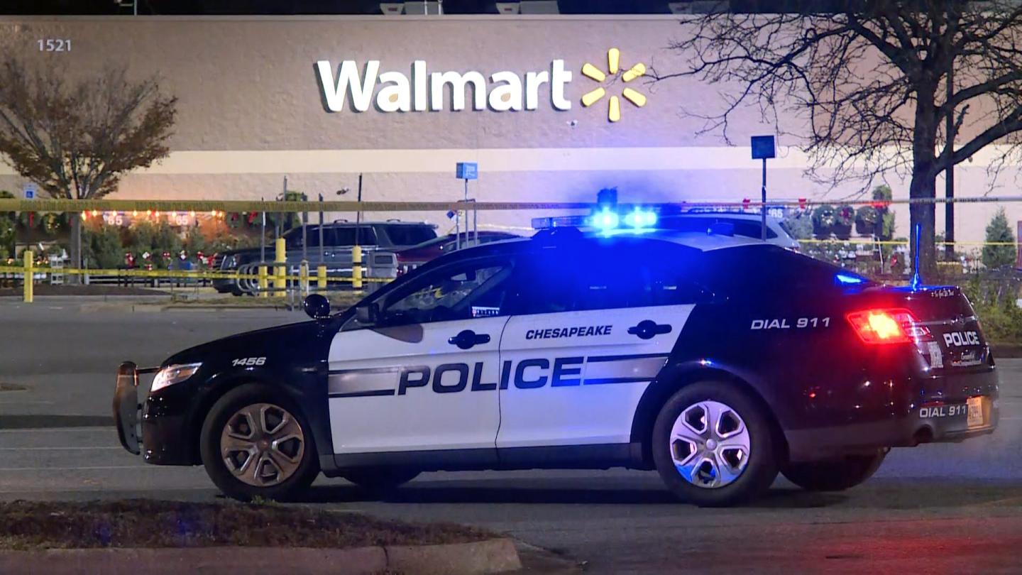 Screen grab from a video shows a police car after at least 10 people were killed in a gun attack at a supermarket in Virginia