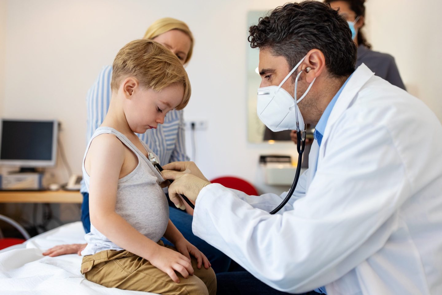 A little boy getting a doctor checkup.
