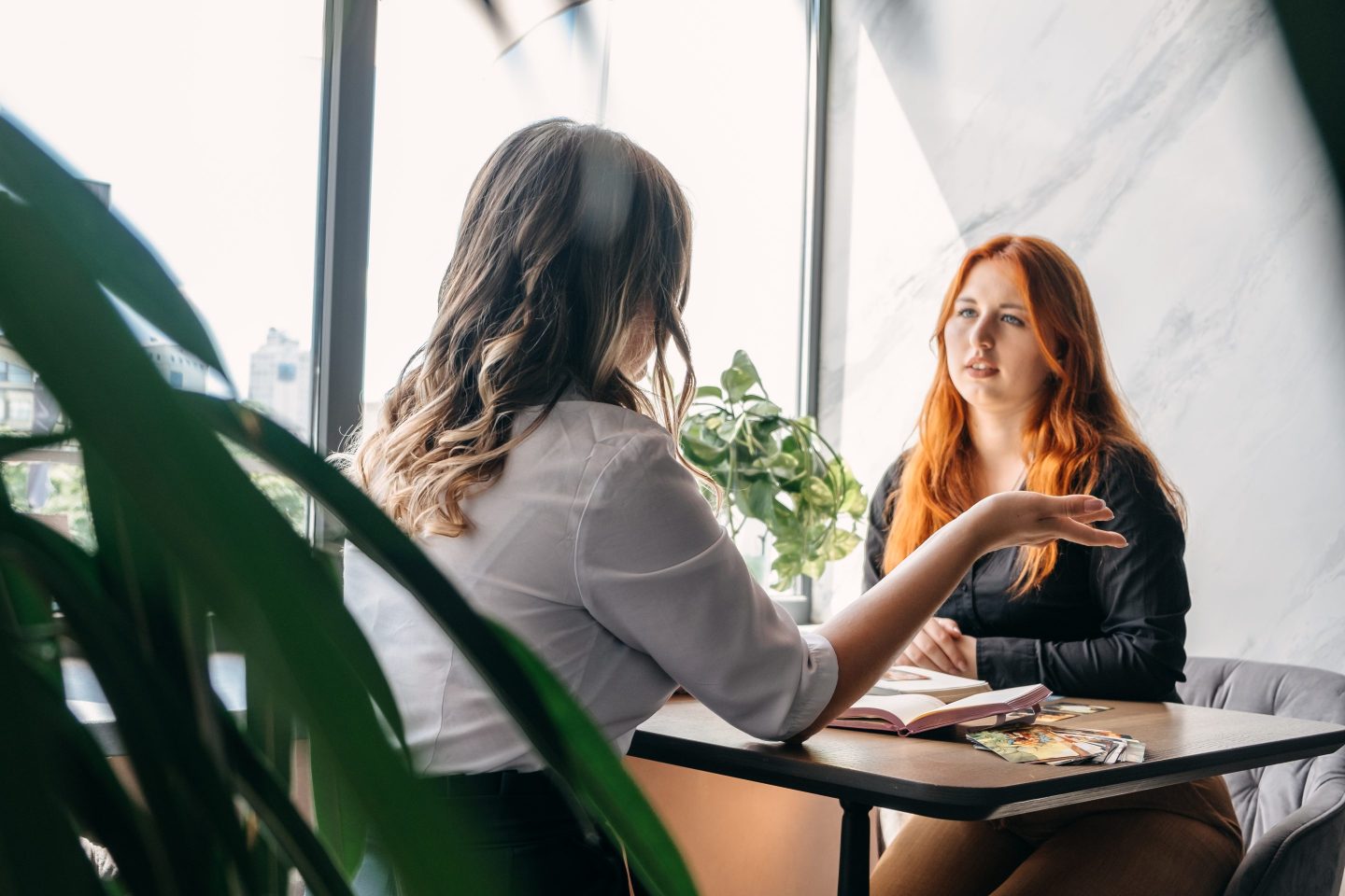 Two women talking at a table