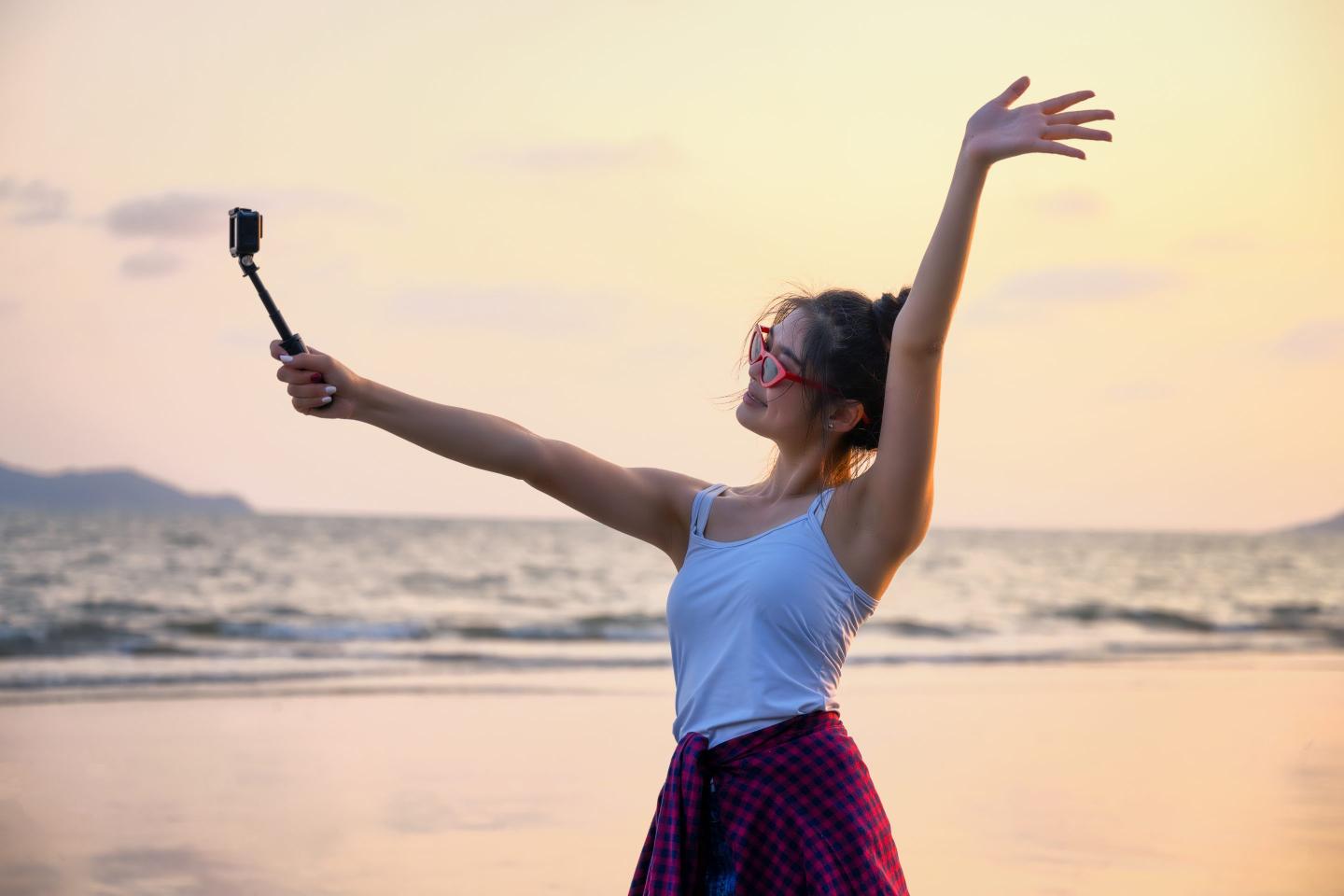 Woman on phone on beach