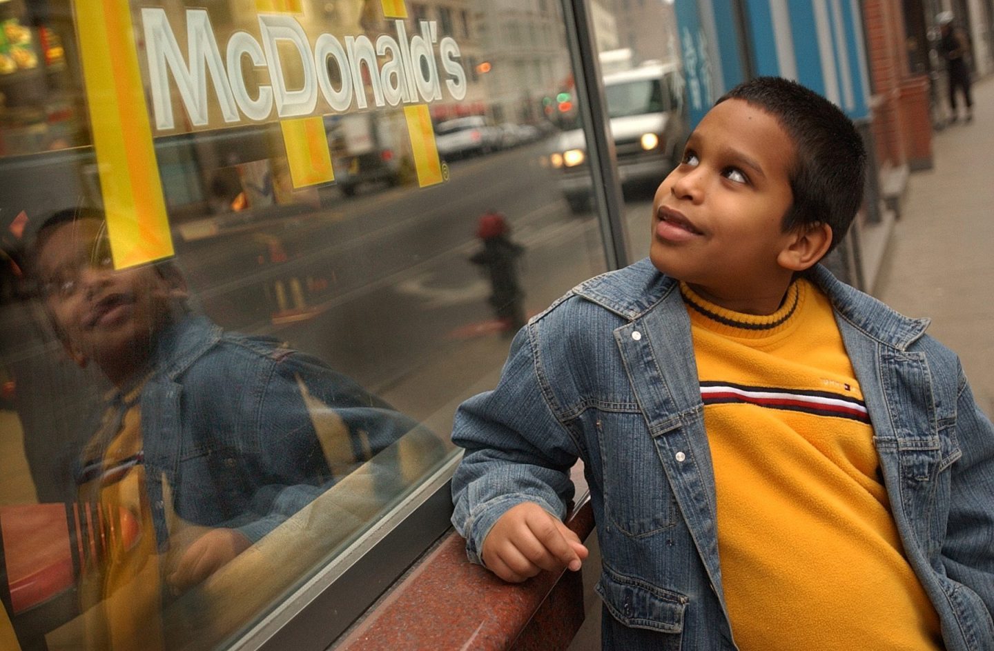 A child in front of a McDonalds