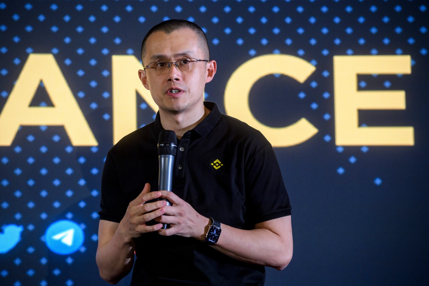Shot of Binance CEO Changpeng Zhao speaking onstage at a Binance event in Italy