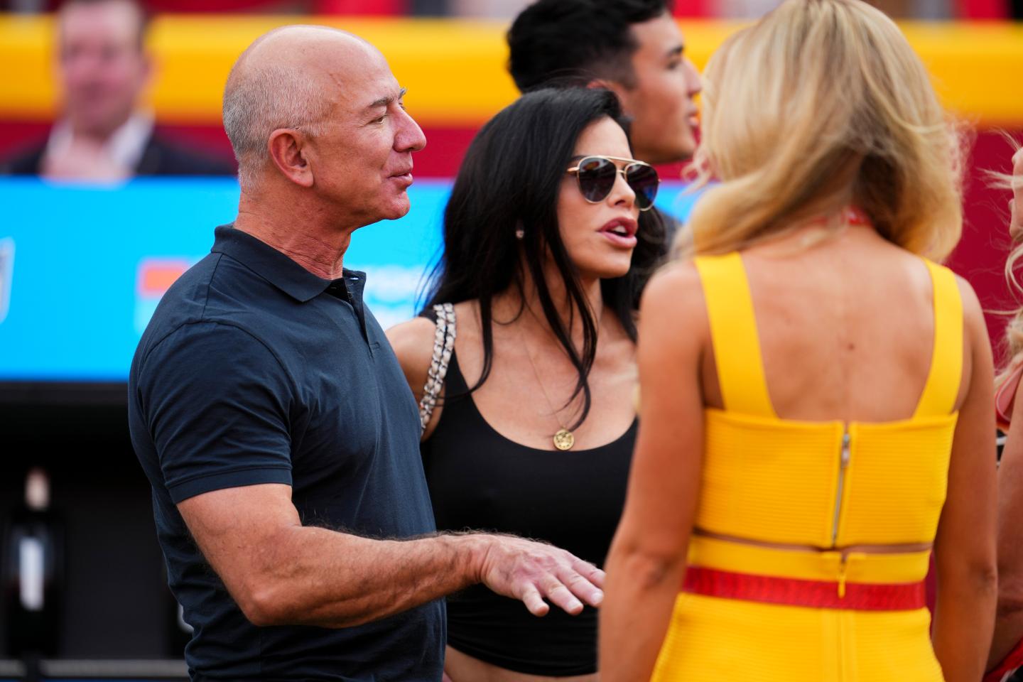 Amazon founder Jeff Bezos speaks with Kansas City Chiefs ownership at GEHA Field at Arrowhead Stadium on Sept. 15, 2022 in Kansas City, Missouri. 
