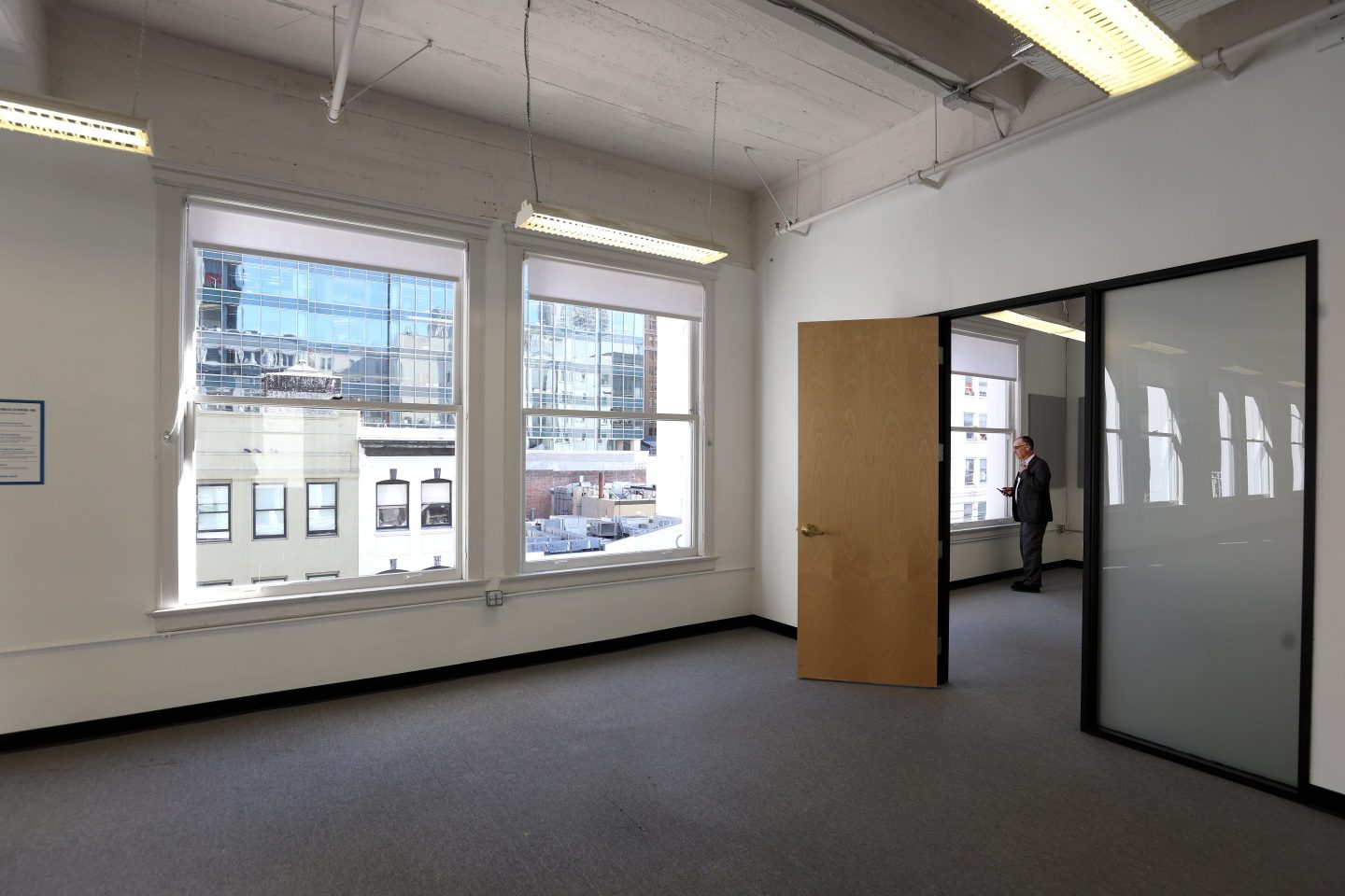 Vacant office with a window and overhead lighting
