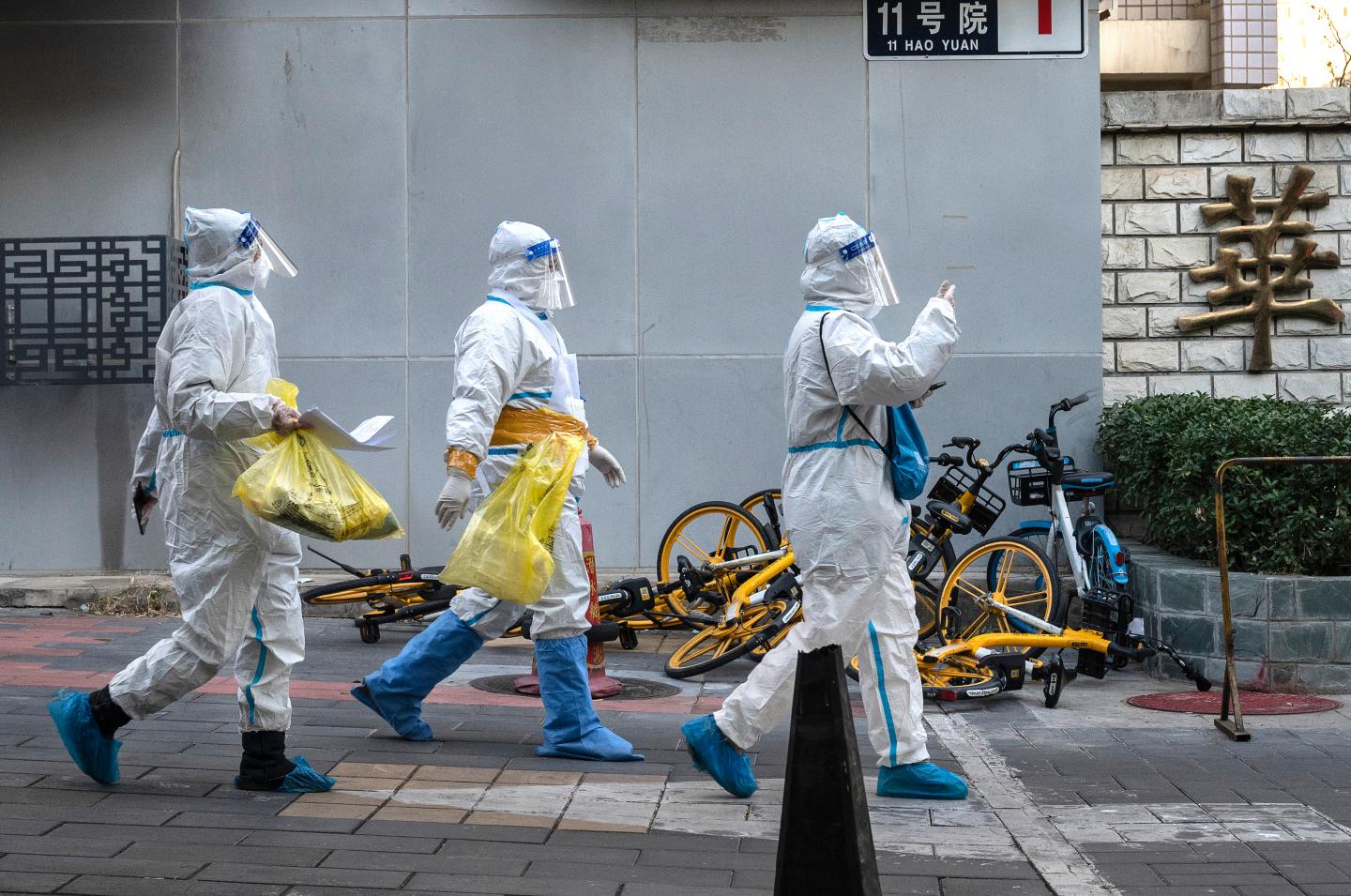 Epidemic control workers on the job in Beijing.
