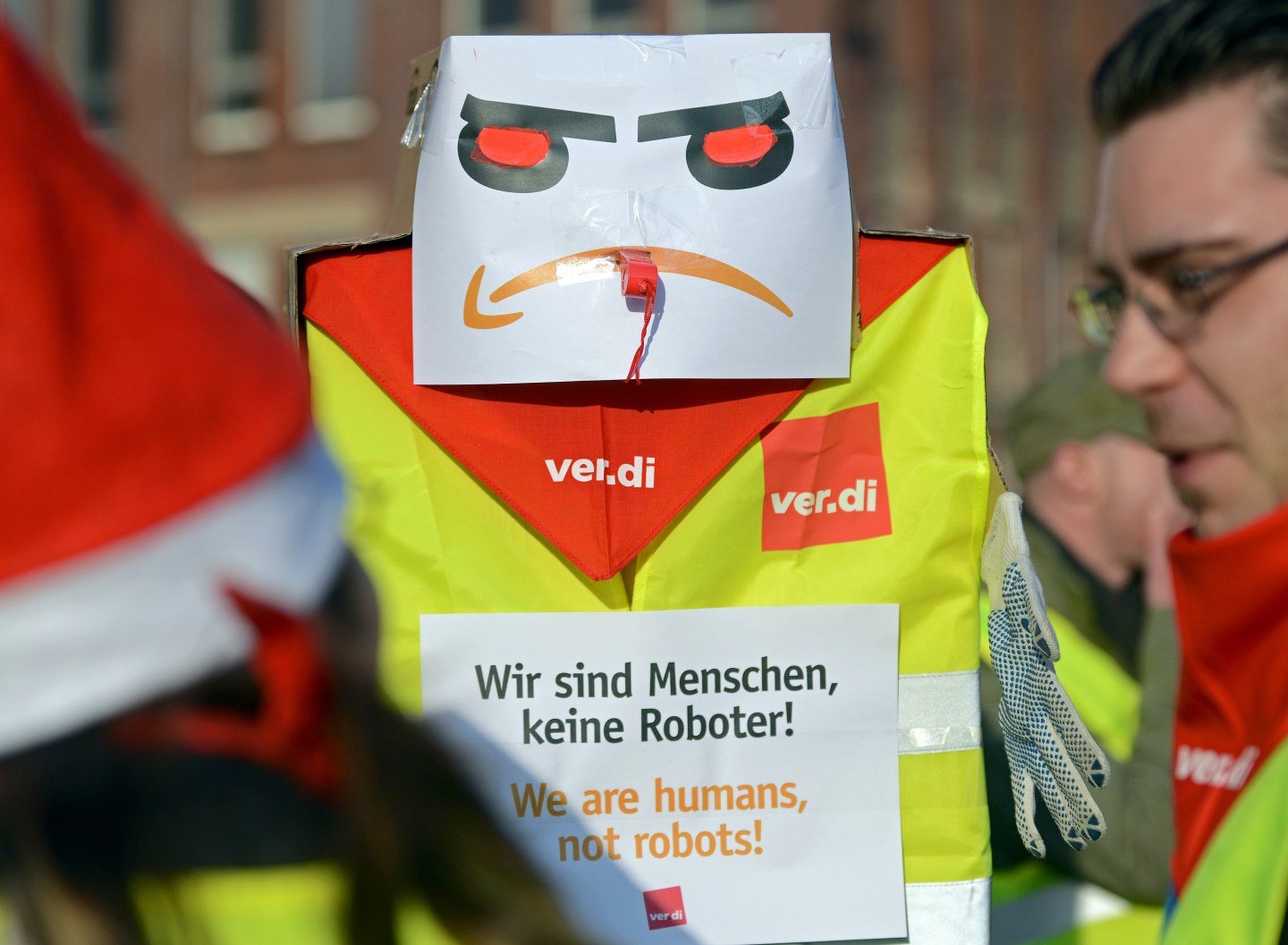 Employees of internet retail giant Amazon stage a strike in front of the company's logistics center in Bad Hersfeld, Germany, on December 18, 2013.