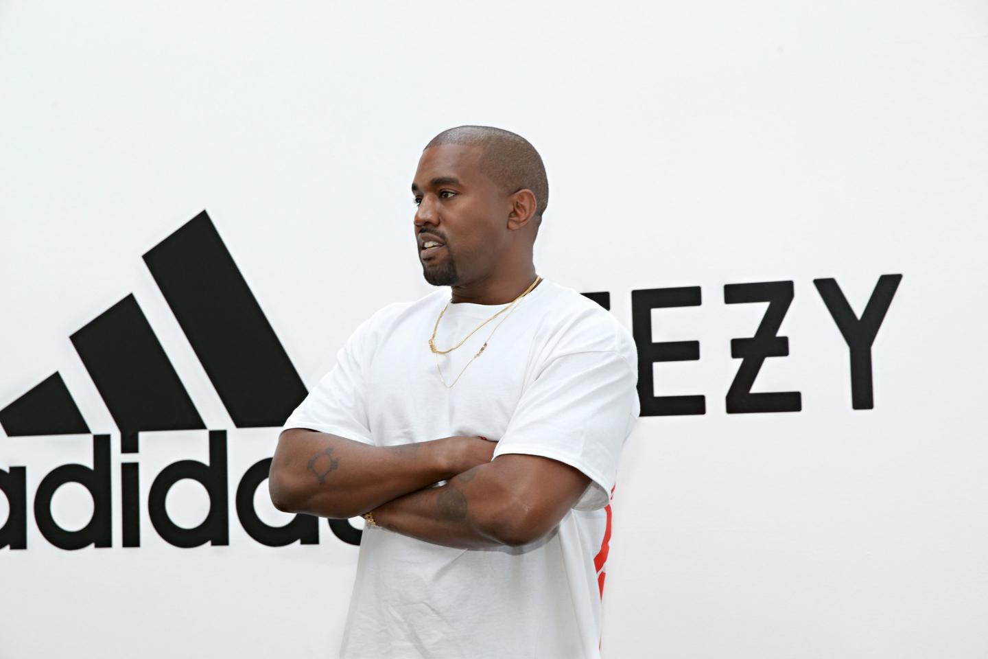 Kanye West stands outside Adidas store