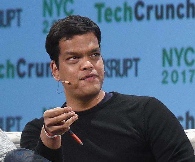 Sriram Krishnan on stage at TechCrunch Disrupt, with pen in hand, talking.