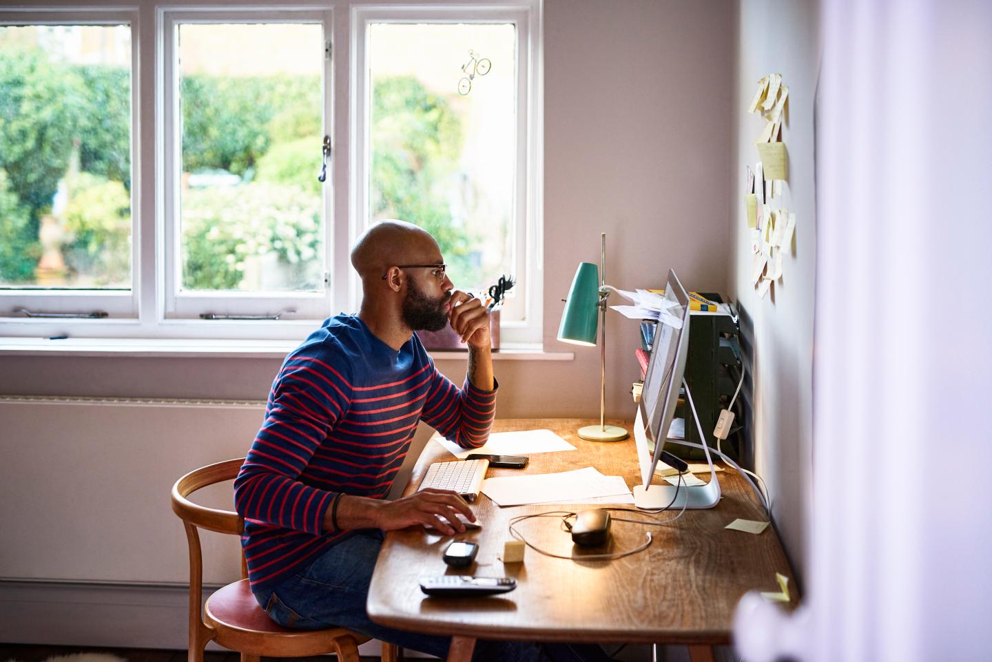 A man working in his home office.