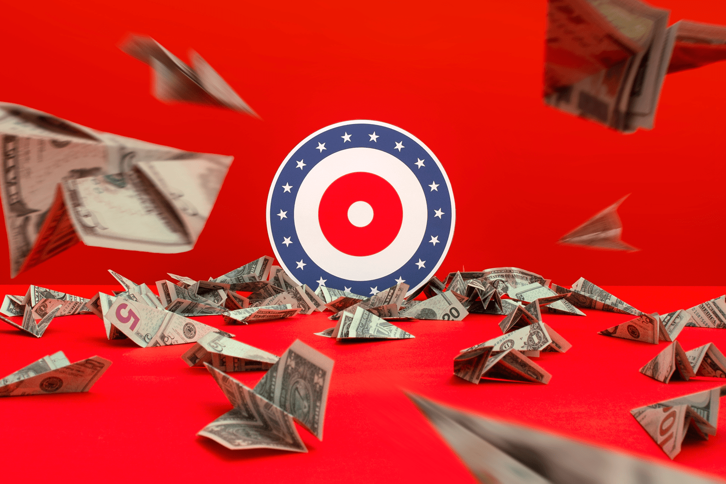 Dollar bills being folded into paper airplanes and thrown at a target.