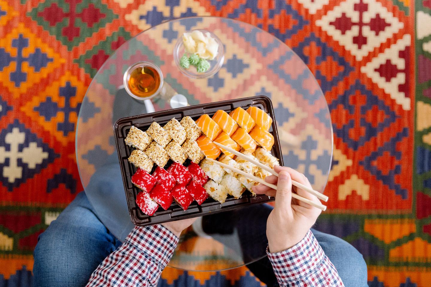 Eating sushi at home.
