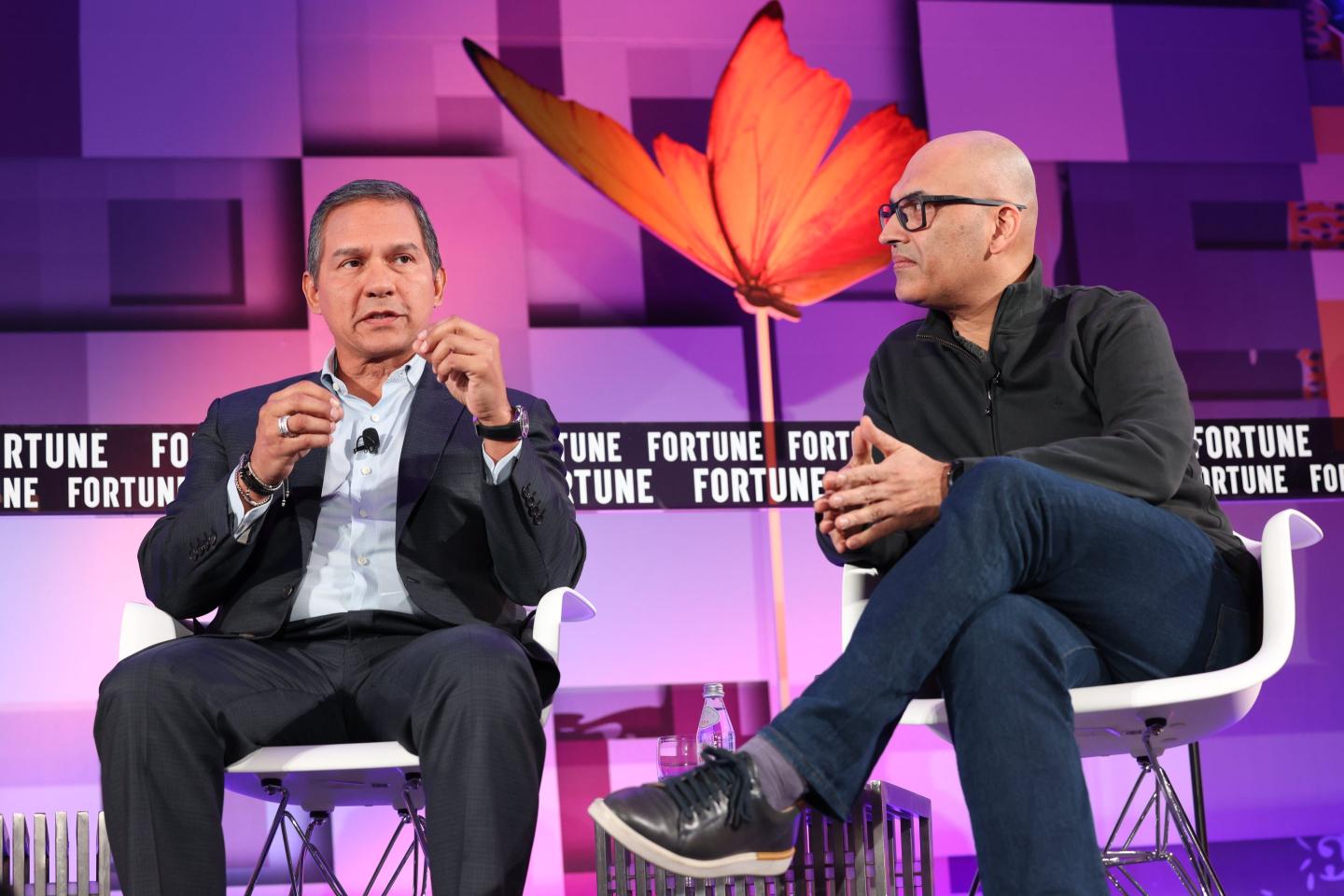 Sanjeev Vohra, global lead - Accenture Applied Intelligence (R), Accenture, and Javier Polit, chief information and digital officer, Mondelez International (L) at Fortune Brainstorm A.I. 2022.