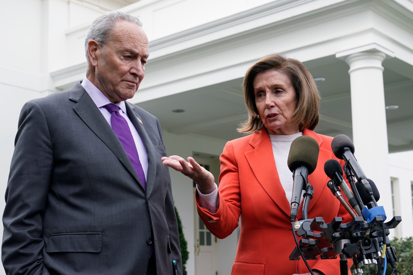 Senate Majority Leader Chuck Schumer of N.Y., right, listens as House Speaker Nancy Pelosi of Calif., left, speaks to reporters at the White House in Washington, Nov. 29, 2022, about their meeting with President Joe Biden. Congress is moving swiftly to prevent a looming U.S. rail workers strike.