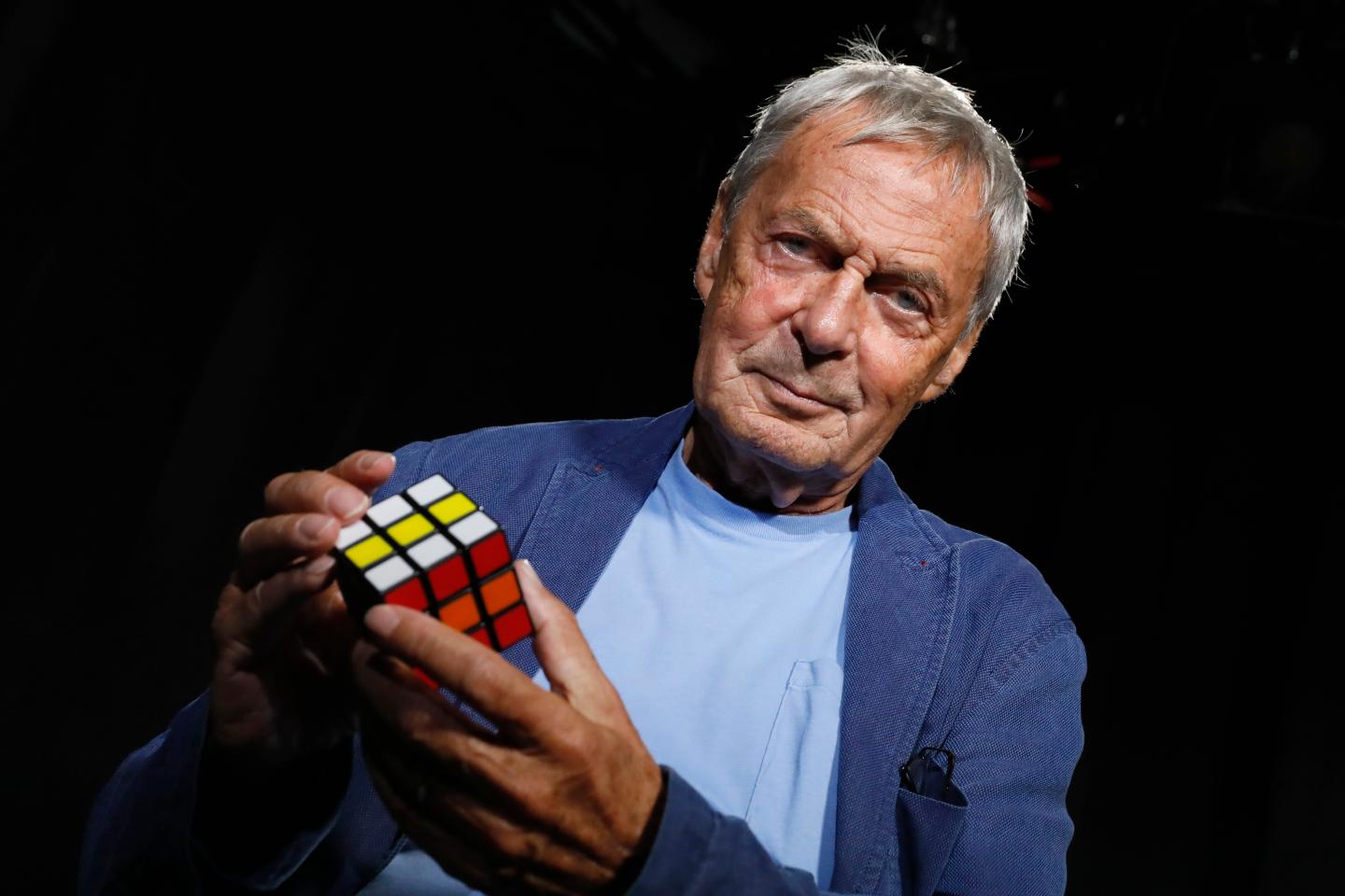 Professor Ernő Rubik, inventor of Rubik's Cube, holding a Rubik's Cube