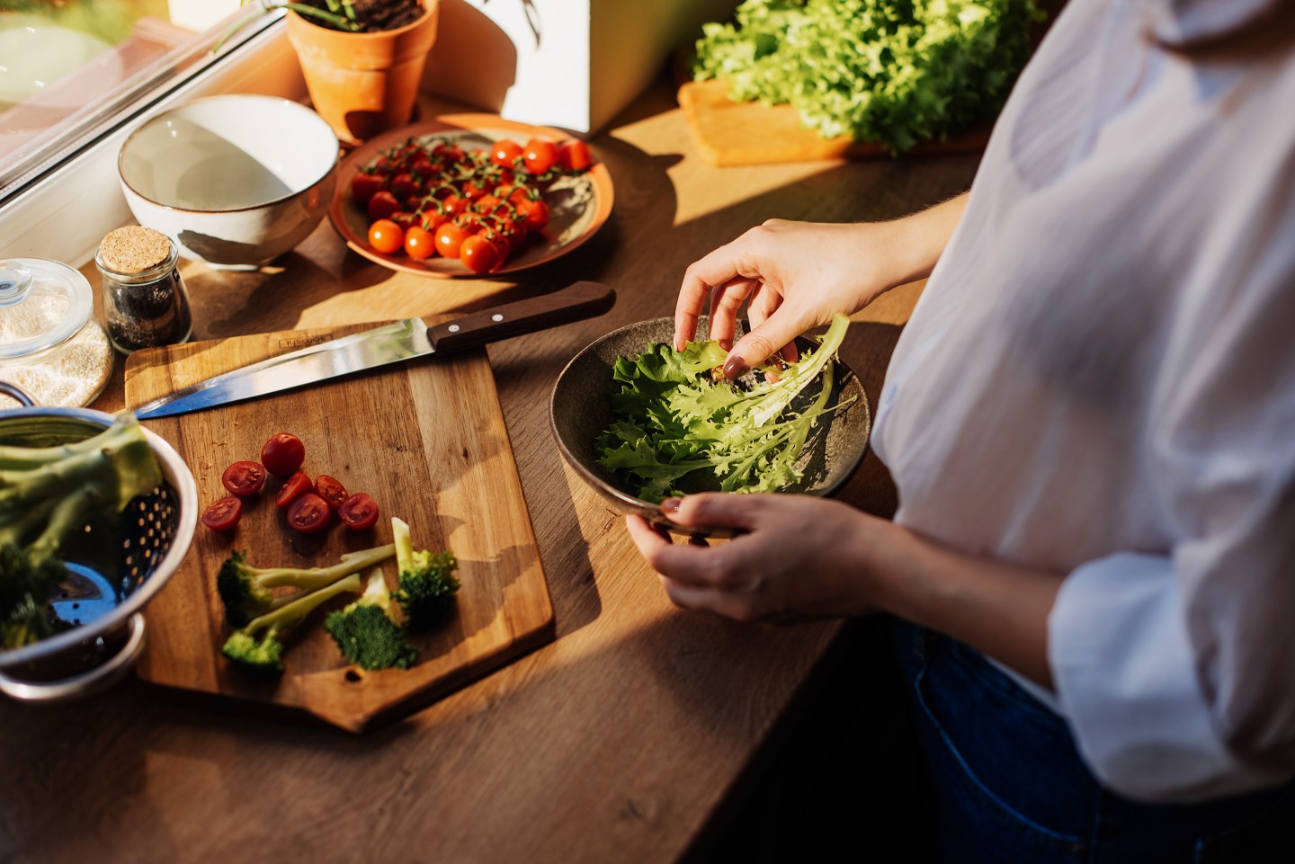 Woman preparing lunch with fresh vegetables