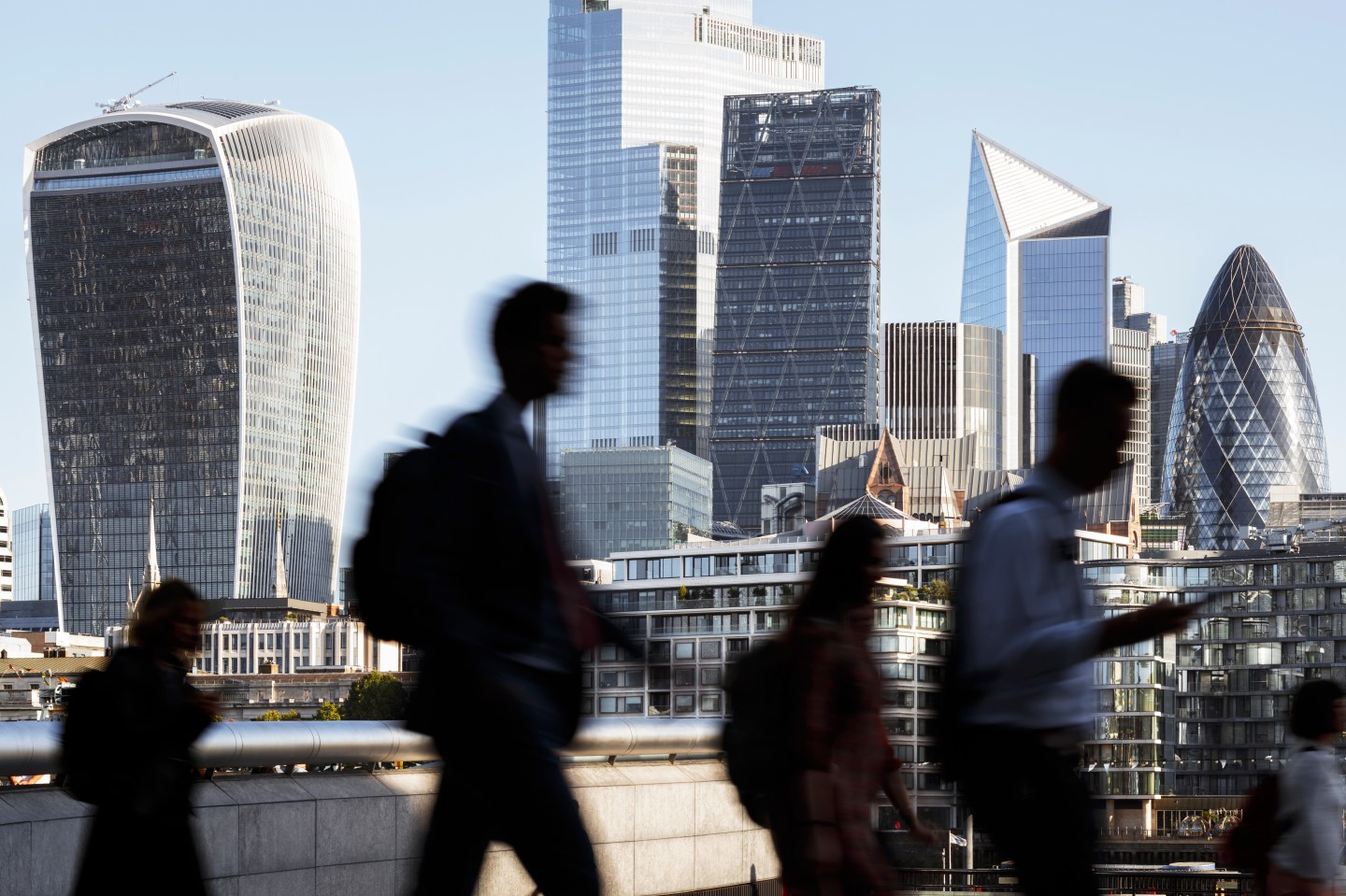 Business people walking through London.