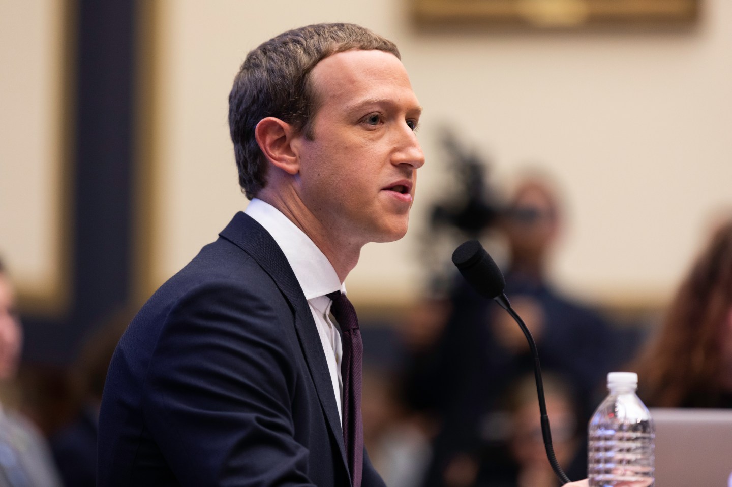 Side shot of Meta CEO Mark Zuckerberg testifying before Congress in 2019