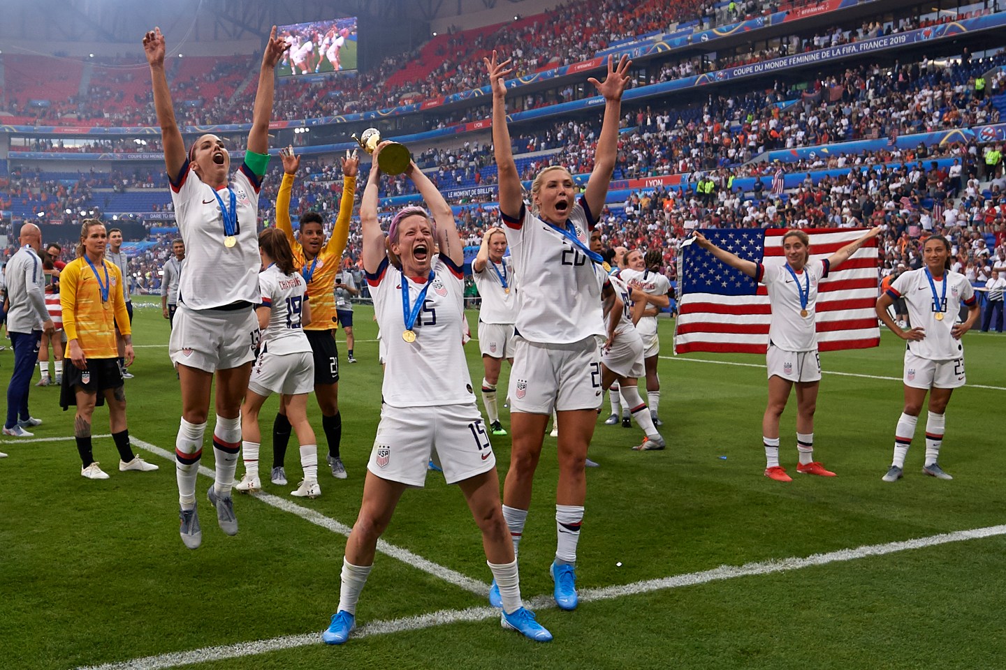 Megan Rapinoe and Alex Morgan of the United States celebrate with teammates after winning the 2019 FIFA Women's World Cup France Final match between The United State of America and The Netherlands at Stade de Lyon on July 7, 2019 in Lyon, France.