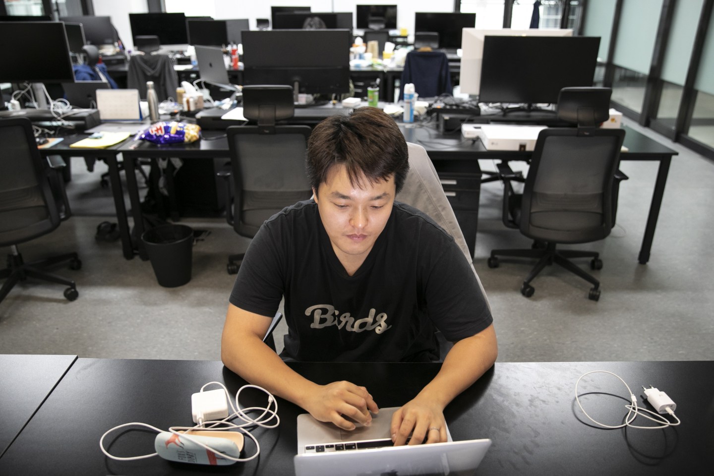 Do Kwon, co-founder and chief executive officer of Terraform Labs, works on his laptop in the company's office in Seoul, South Korea, on April 14, 2022. 
