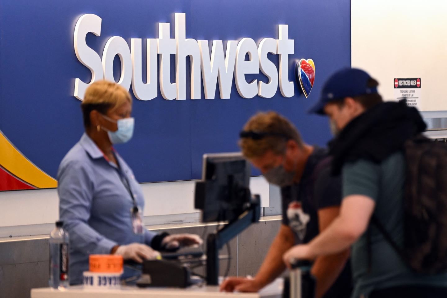 Passengers checking in at a Southwest Airlines flight at Los Angeles International Airport