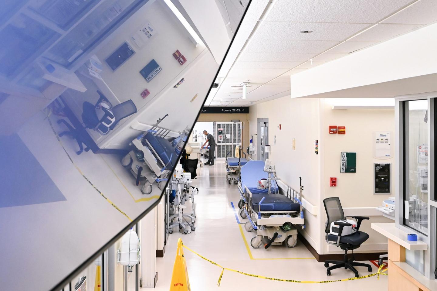 A hospital hallway with empty gurneys