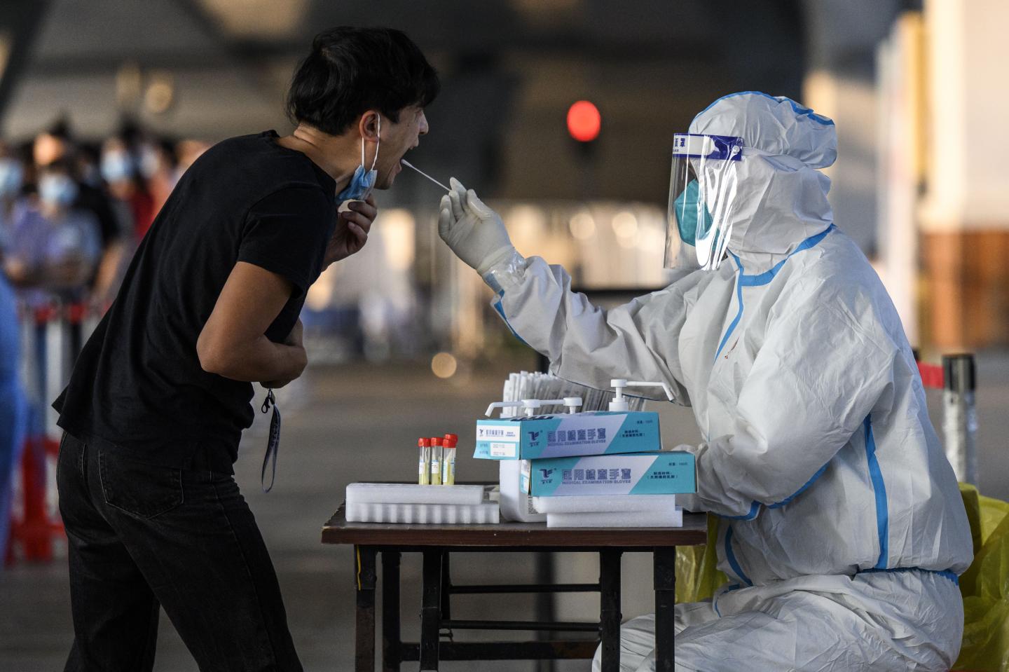 Overwhelmed by a massive outbreak, China authorizes emergency use of Merck COVID pill Lagevrio