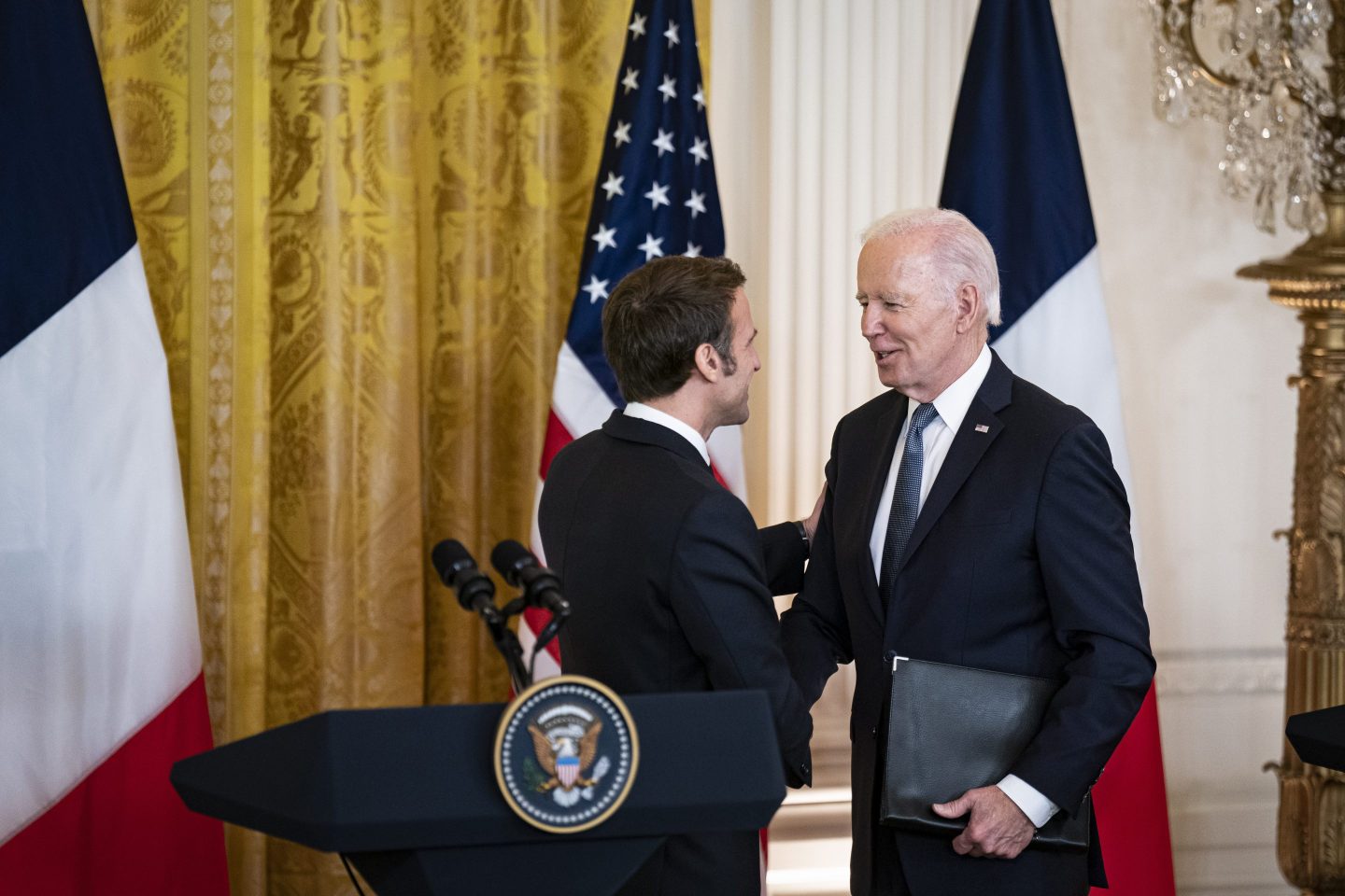 President Joe Biden shakes hands with French President Emmanuel Macron during a state visit on Dec. 1, setting aside recent tensions with Paris over defense and trade issues to celebrate the oldest U.S. alliance.