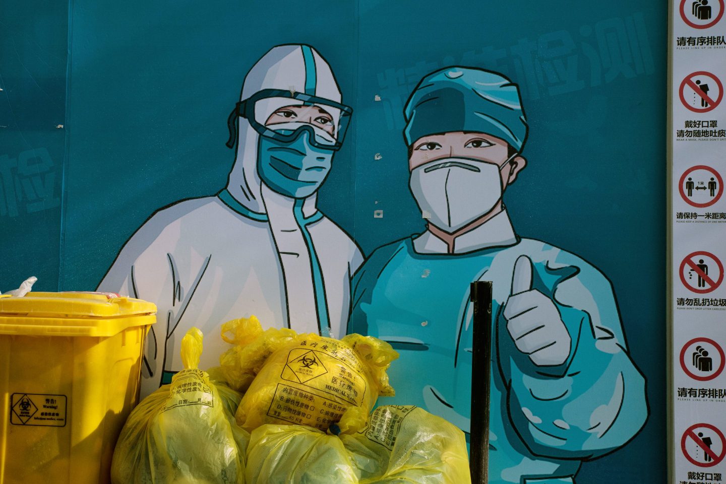 A mural of Chinese healthcare workers in protective gear