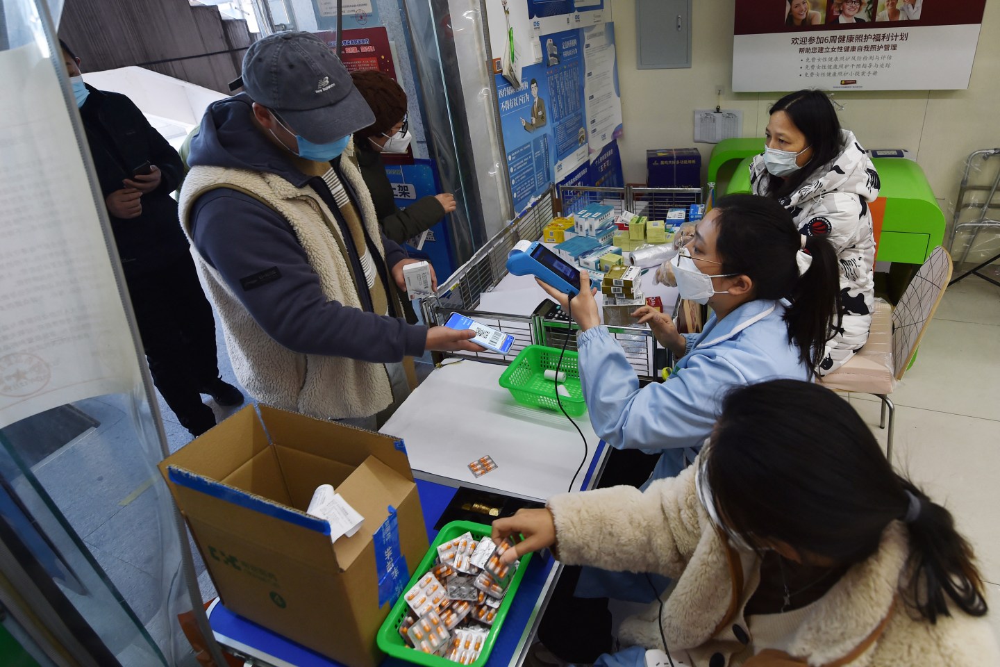 A man buys fever medicine at a pharmacy amid the COVID-19 pandemic in Nanjing, in China's eastern Jiangsu province, on Dec. 19, 2022.