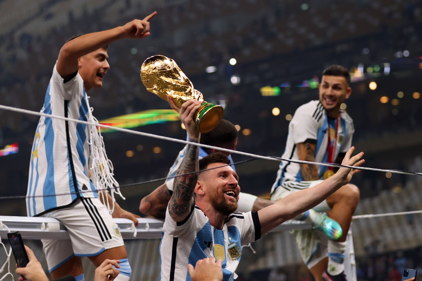 Lionel Messi and teammates celebrate their World Cup victory.