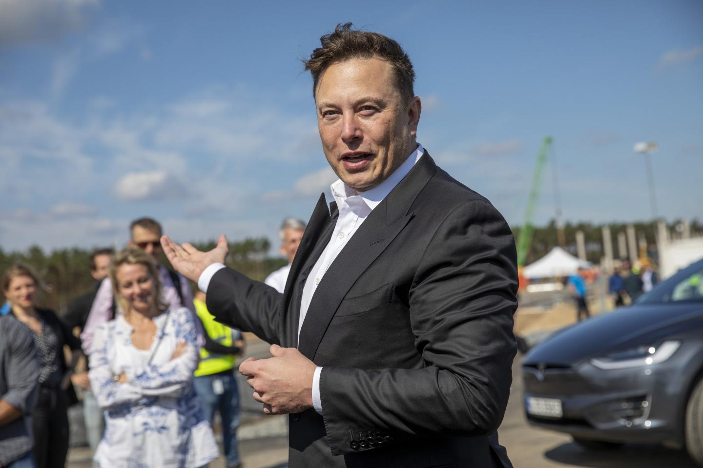 Tesla head Elon Musk talks to the press as he arrives to to have a look at the construction site of the new Tesla Gigafactory near Berlin on September 03, 2020 near Gruenheide, Germany.