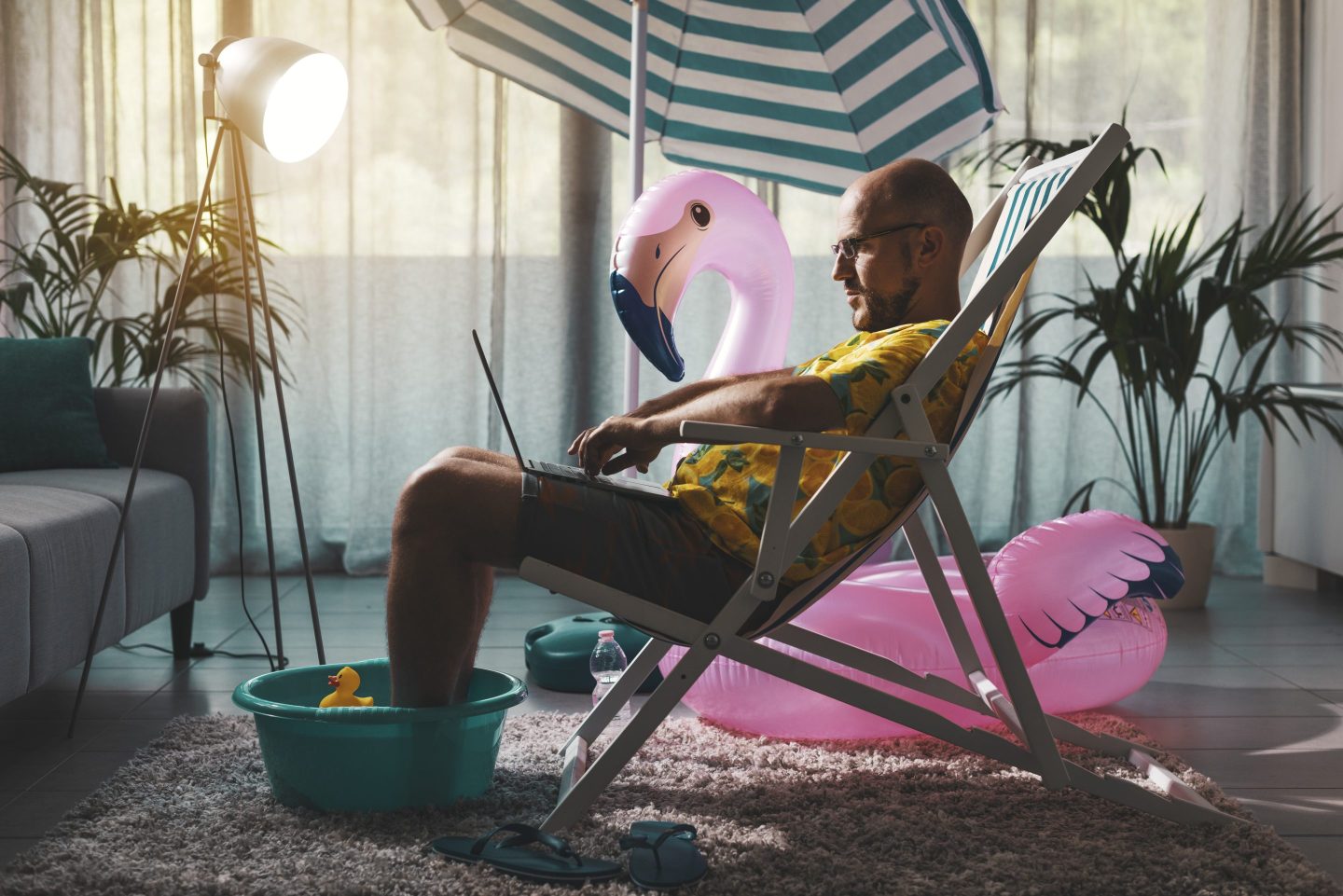 man on beach chair in living room