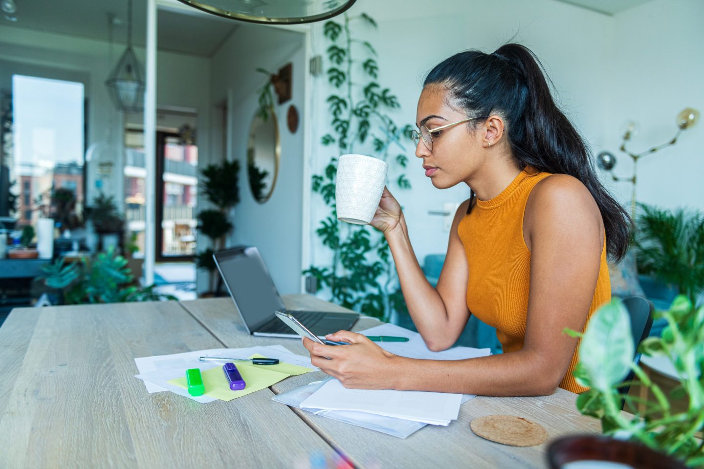 Woman at desk reviewing paperwork