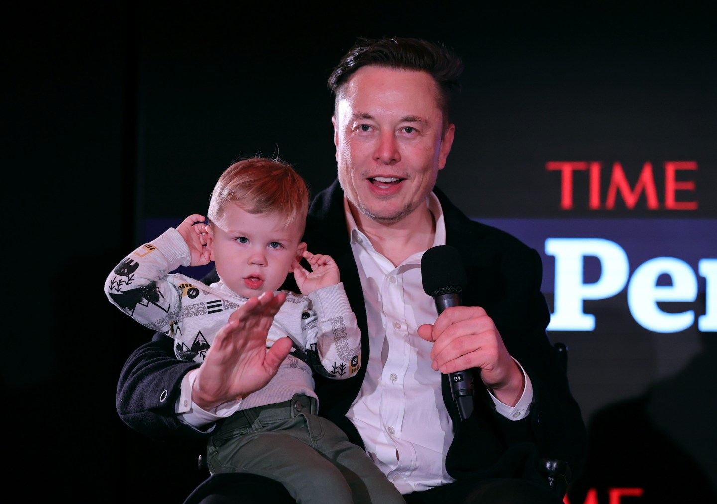 Twitter owner Elon Musk and his son X.