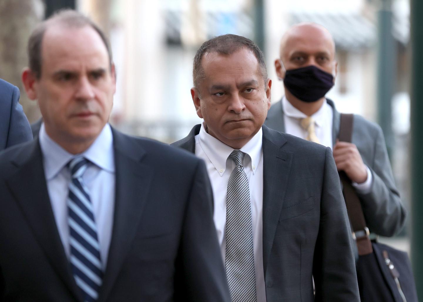 Former Theranos COO Ramesh "Sunny" Balwani (2R) arrives at the Robert F. Peckham U.S. Federal Court