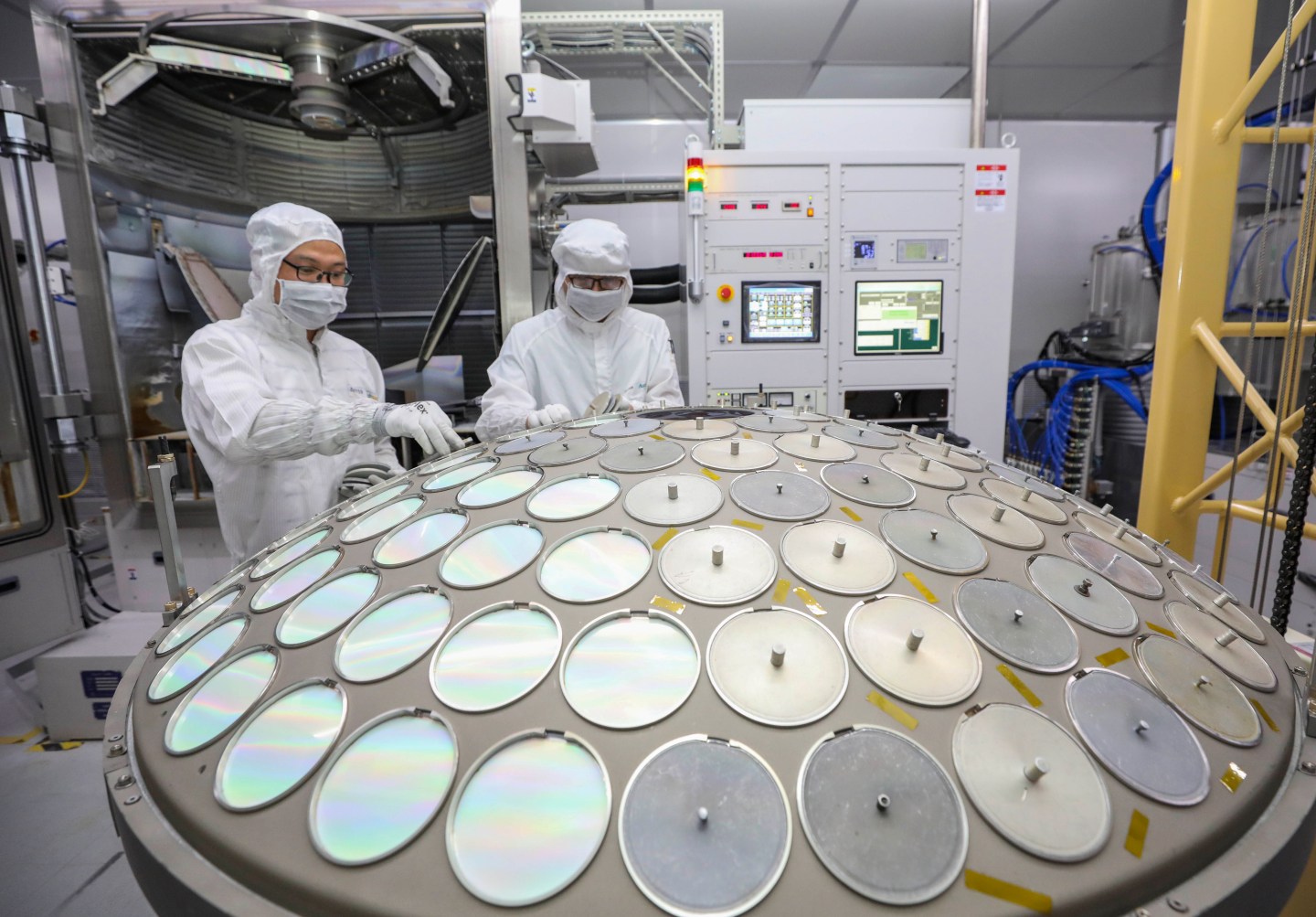 Employees work on the production line of semiconductor wafer at a factory of Jiangsu Azure Corporation Cuoda Group on Sept. 27, 2022 in Huai'an, Jiangsu Province of China.