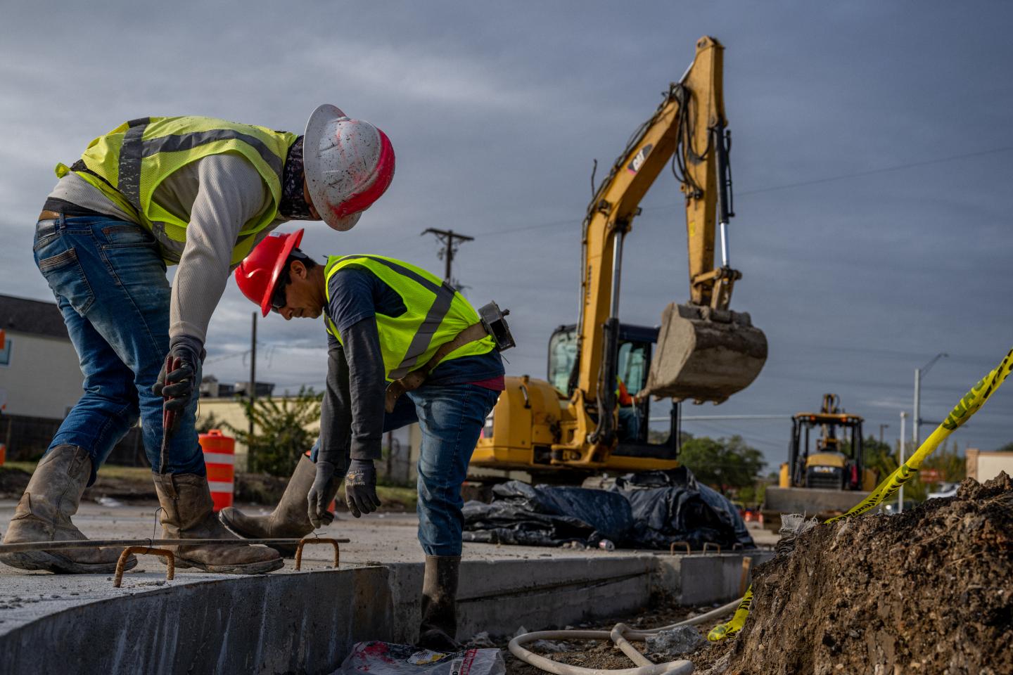 Construction workers repairing a street.