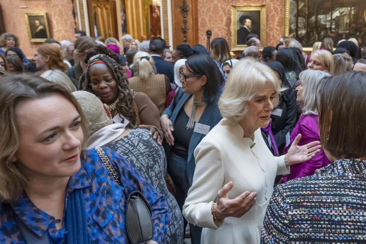 A group of people with a white woman at the front and a black woman over her left shoulder