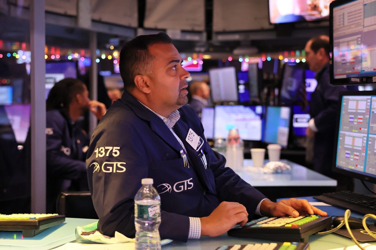Traders work on the floor of the New York Stock Exchange during morning trading on December 02, 2022 in New York City.