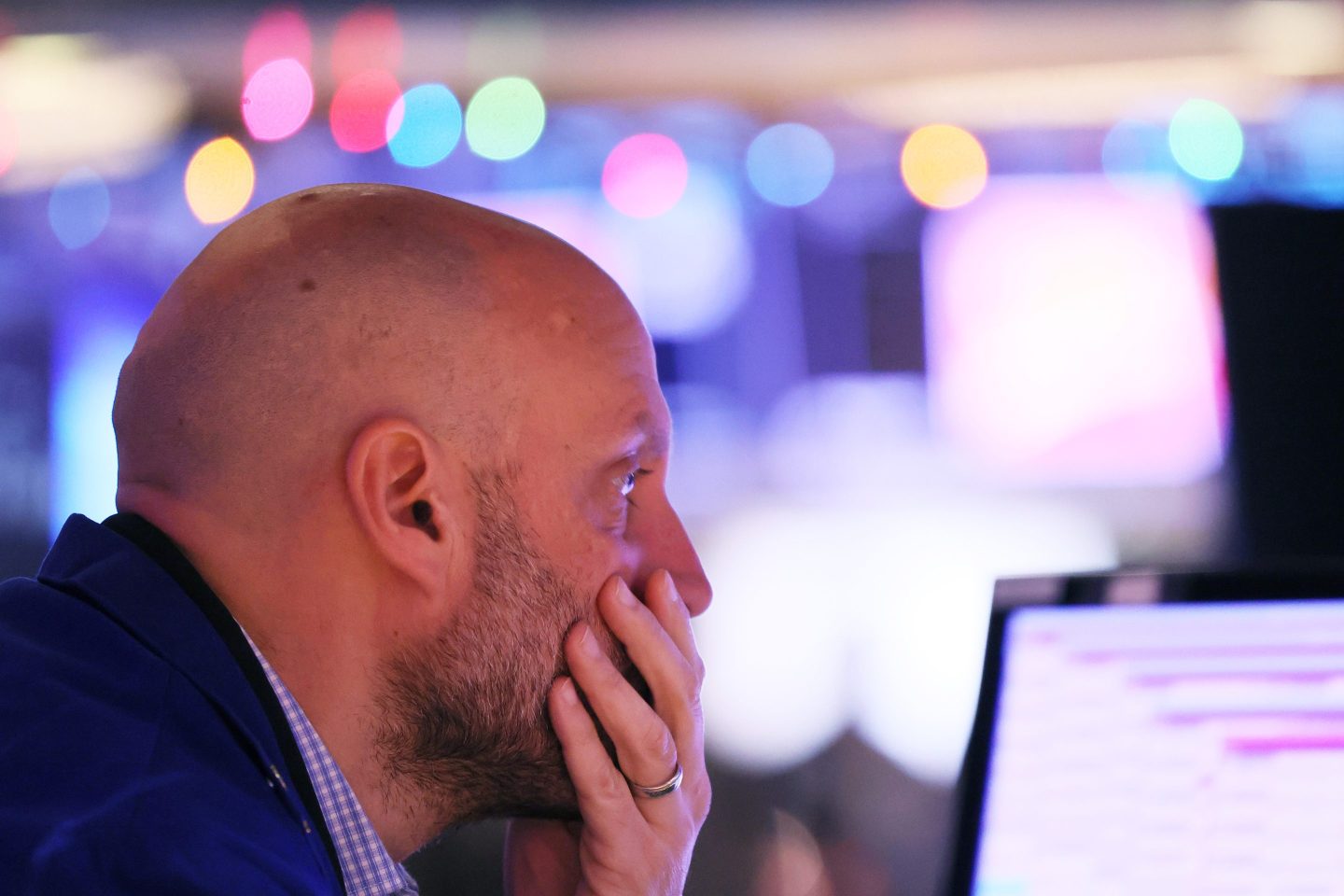 A trader works on the floor of the New York Stock Exchange during morning trading on Dec. 2, 2022, in New York City.