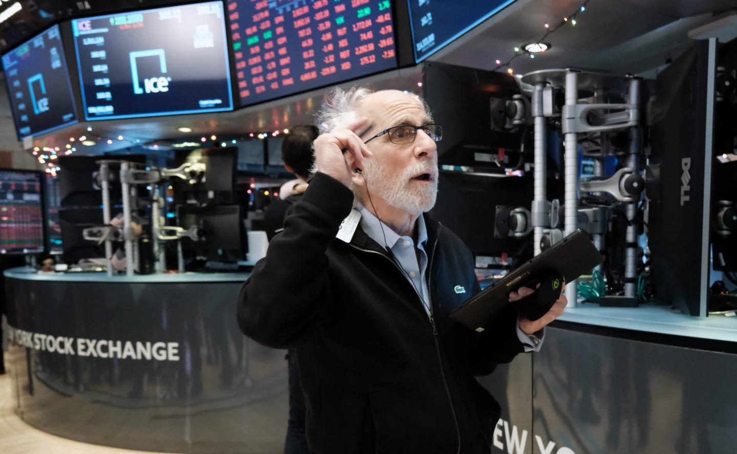 Stock trader Peter Tuchman works on the floor of the New York Stock Exchange (NYSE) on December 15, 2022 in New York City.