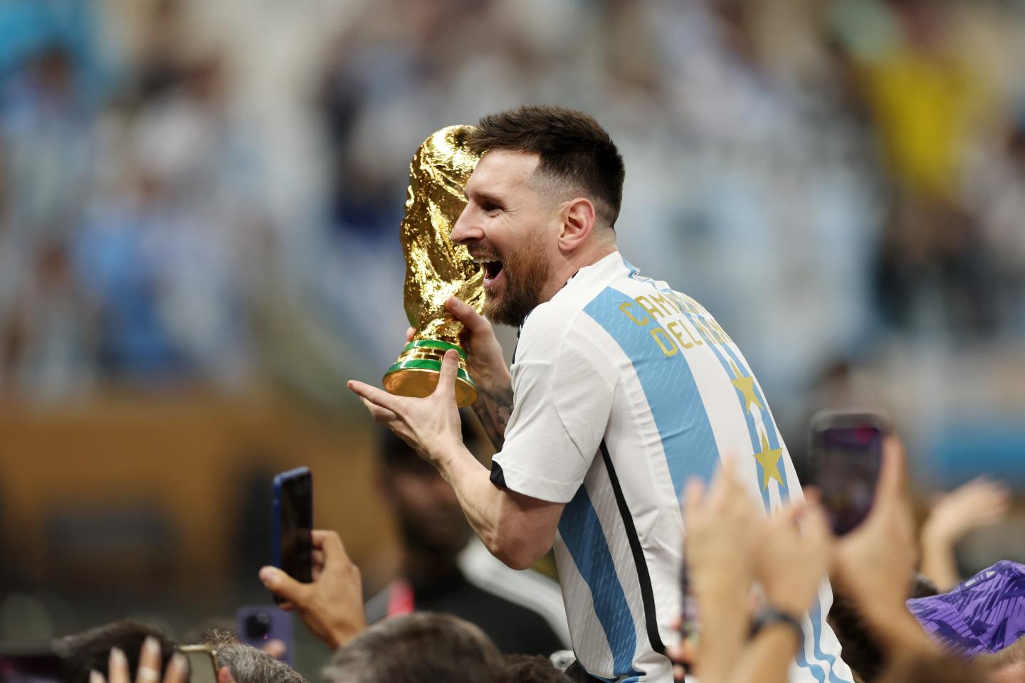 Lionel Messi holds World Cup trophy