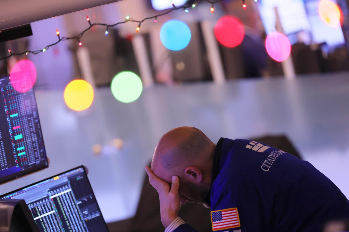 Traders work on the floor of the New York Stock Exchange during afternoon trading on December 21, 2022, in New York City.