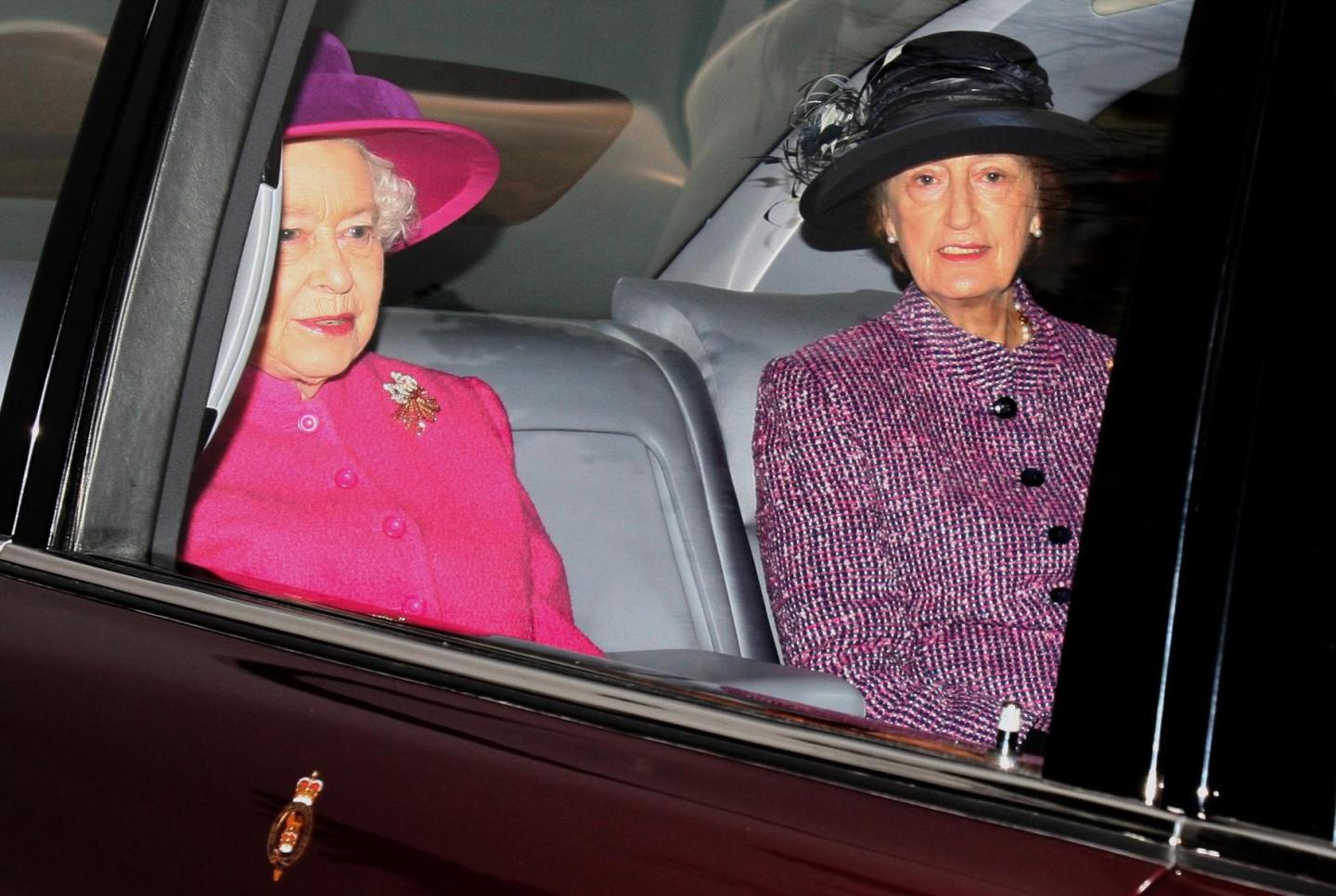 Lady Susan Hussey sits next to the late Queen