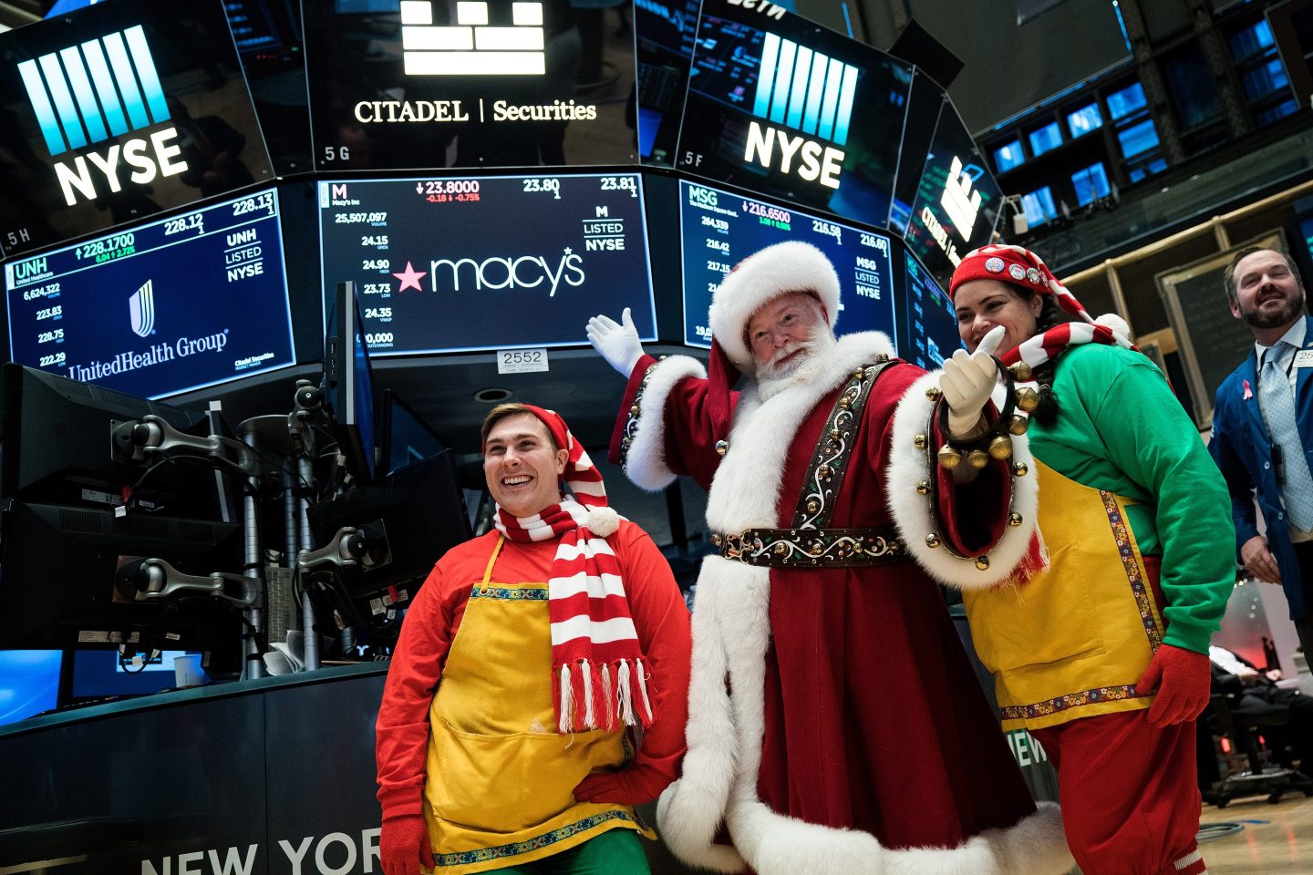 A man dressed as Santa Claus visits the floor of the New York Stock Exchange (NYSE) ahead of the closing bell, November 30, 2017 in New York City.