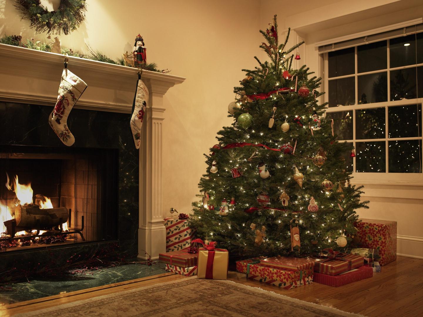 A Christmas tree in a living room.