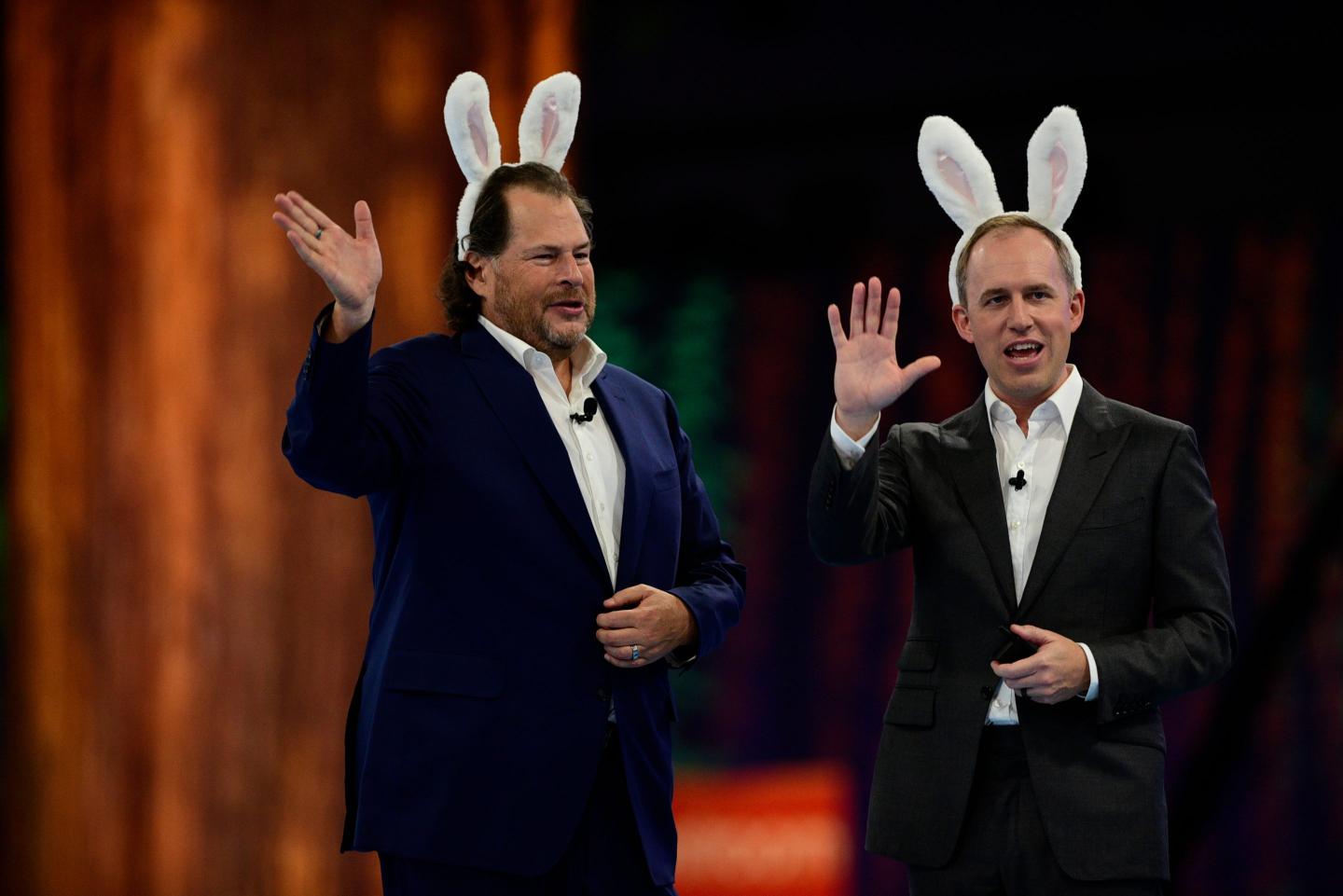 Bret Taylor, former co-chief executive officer of Salesforce.com Inc., right, and Marc Benioff, co-chief executive officer of Salesforce.com Inc., wear rabbit ears during a keynote at the 2022 Dreamforce conference in San Francisco,