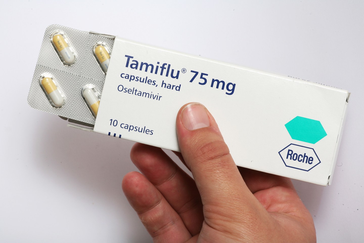Generic pictures of Tamiflu capsules and packaging.