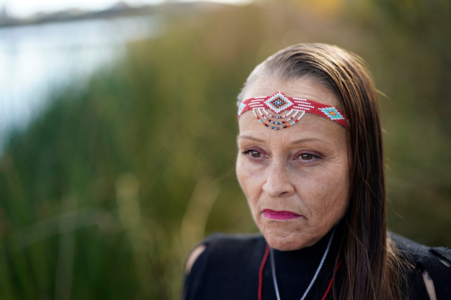 Pulido stands by the shore at Harbor Lake.
