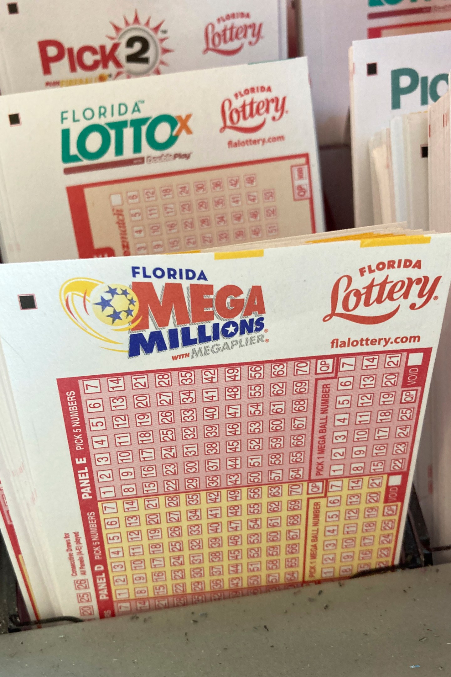 Mega Millions lottery playing slips are shown at a supermarket kiosk, Monday, Jan. 2, 2023, in Surfside, Fla.